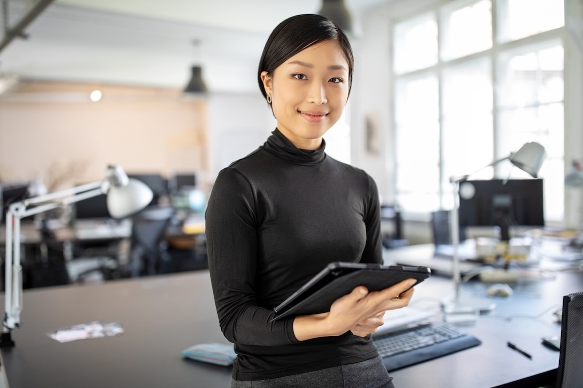 woman holding tablet