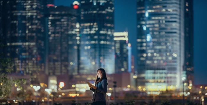 Lady standing in front of city scape