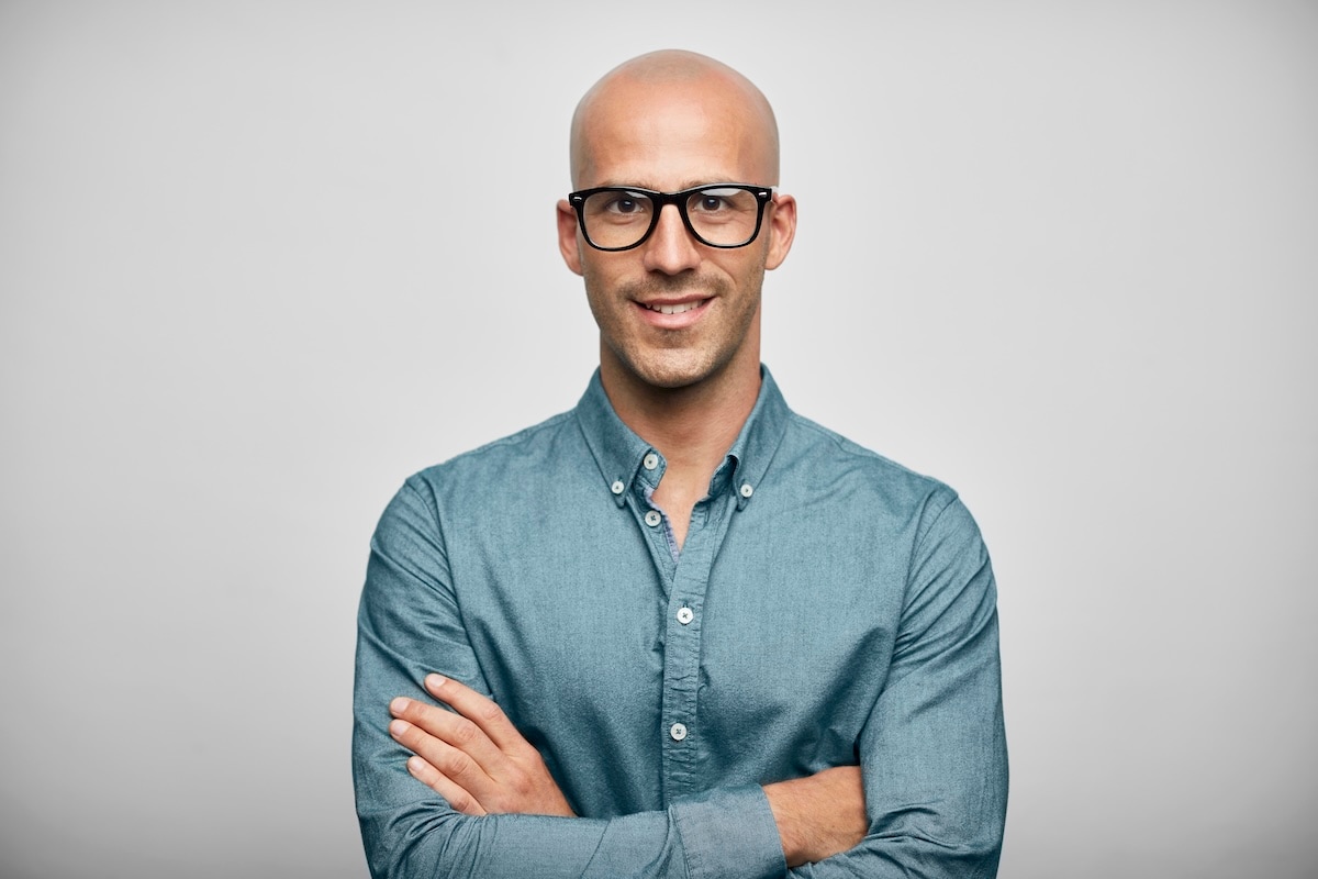 man with glasses in office clothes