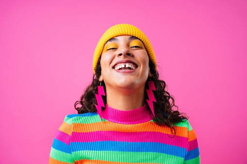 Lady in bright striped jumper and yellow hat