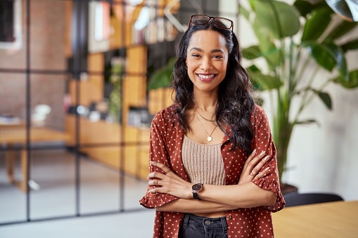 Lady in brown cardigan with arms folded 