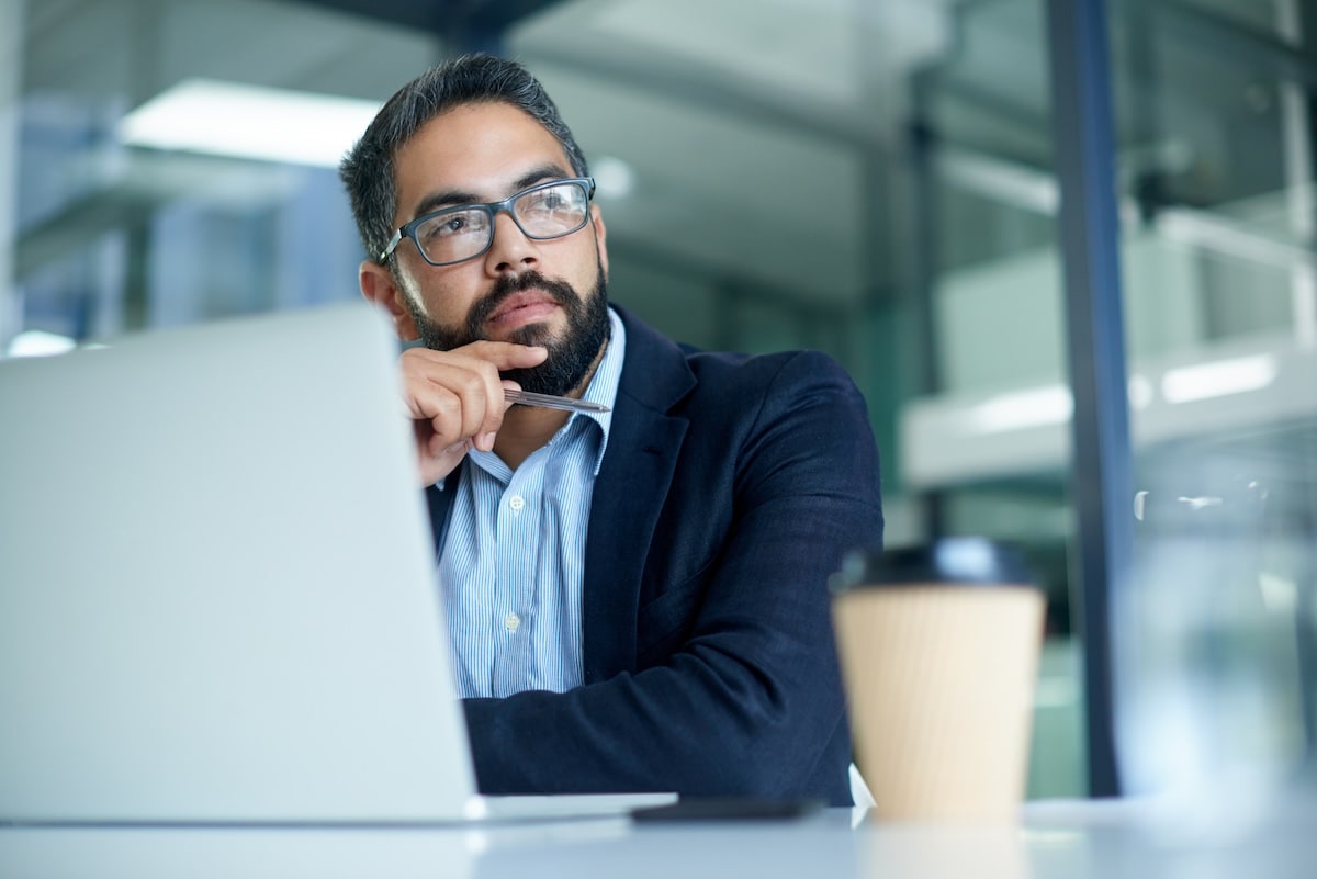 man on computer looking away