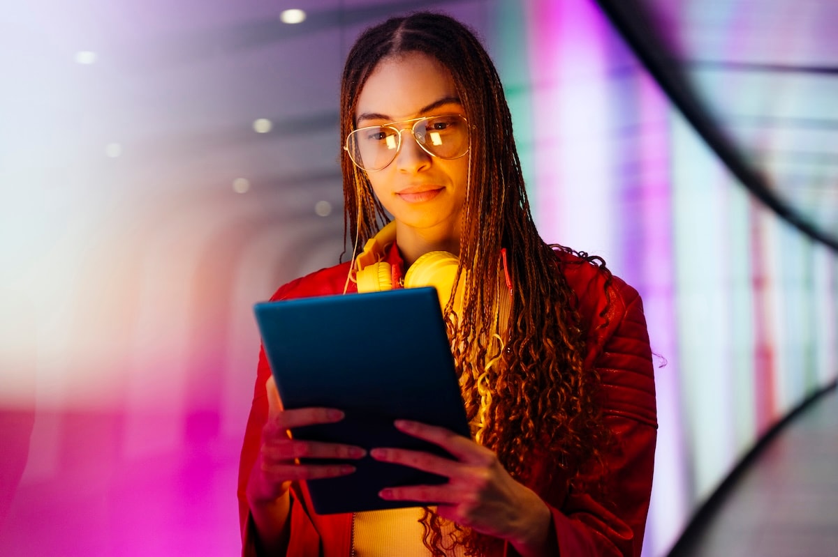 woman holding tablet